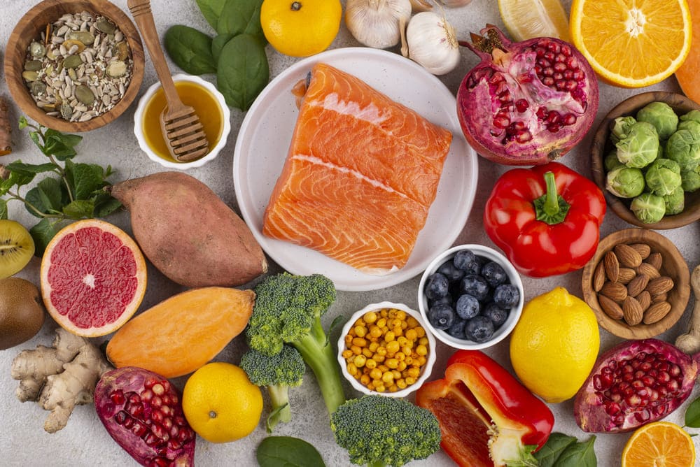 The image illustrates a variety of food that can help to build eczema-prone skin